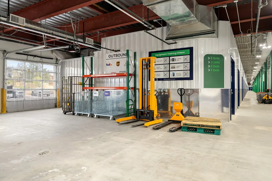 WareSpace facility at dusk showing the scale of the building and lit loading docks