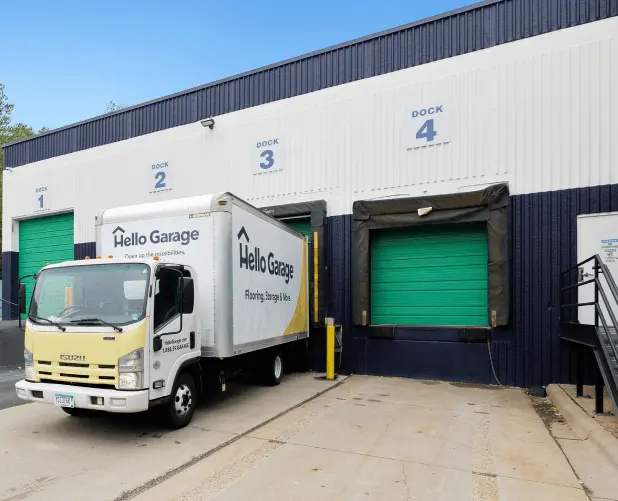 WareSpace numbered loading docks with dock-high doors and a box truck backed in